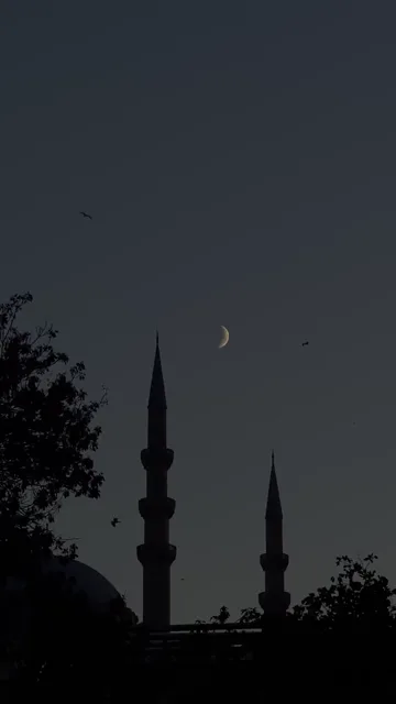 Quran video background: Moon over a mosque